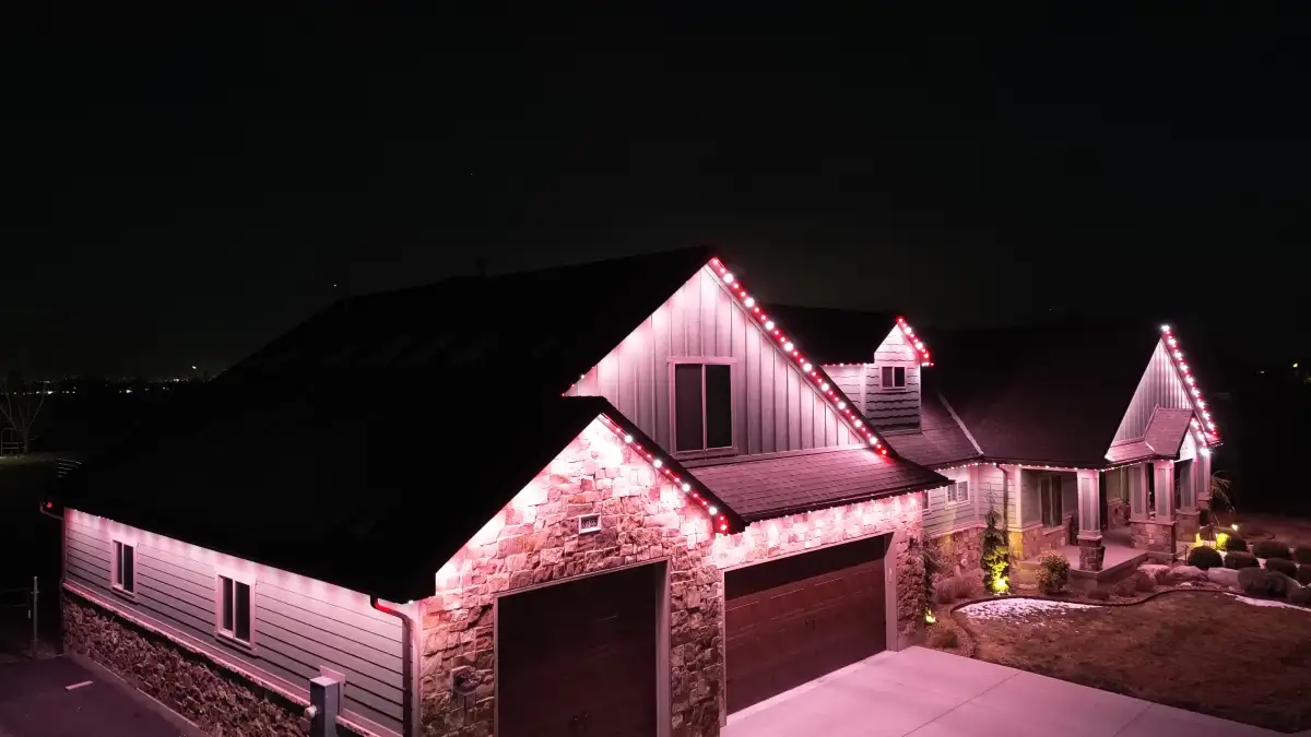 Christmas lights on home exterior at night