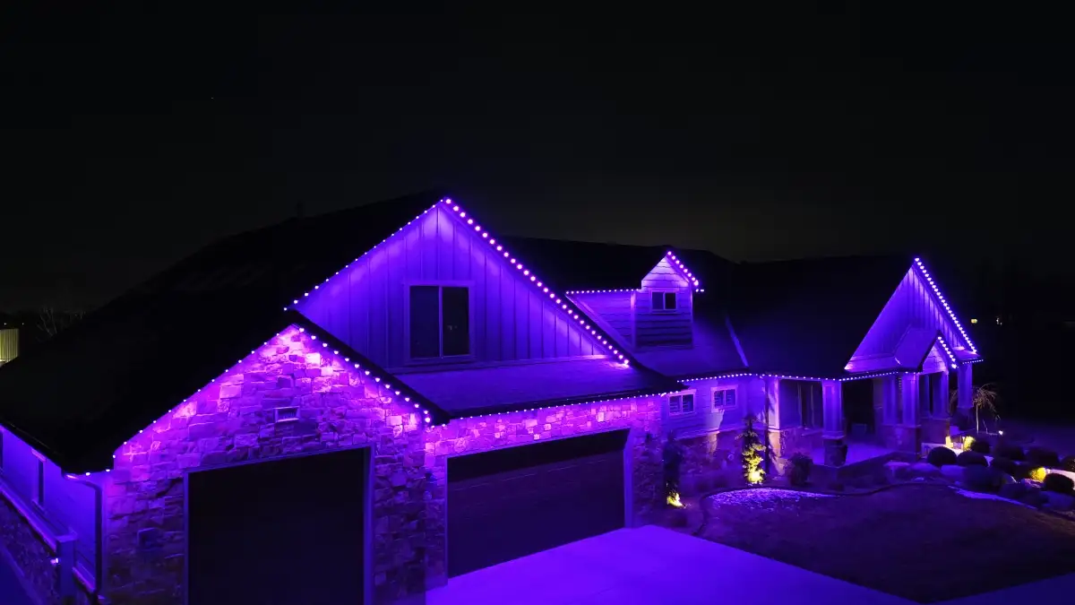 Red and green holiday lights on home eaves